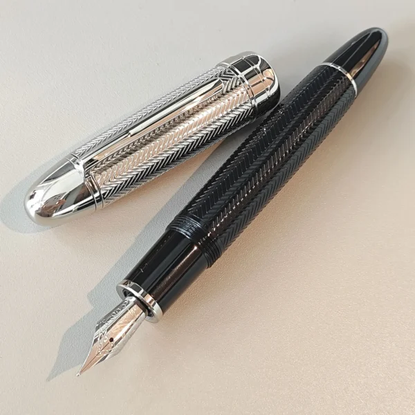 H0c27f28b9afb43d4958a6d4fcba888d94.webp JD 149 Carved-Design Writing Pen – Classic Metal Finish