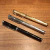H828dc98ea2ff4711bd697fafe97f6a20E.webp Gold & Silver-Tone Fountain Pen – Elegant Writing Design